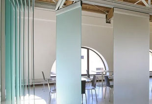Comparison of sliding folding partition vs glass partition for office and commercial space design