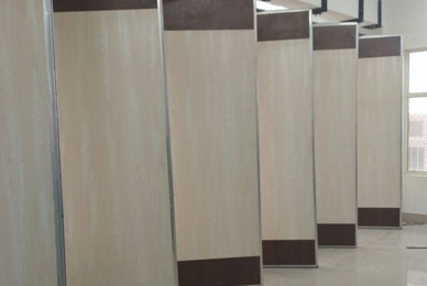 Glass sliding partition system in commercial space for modern interiors